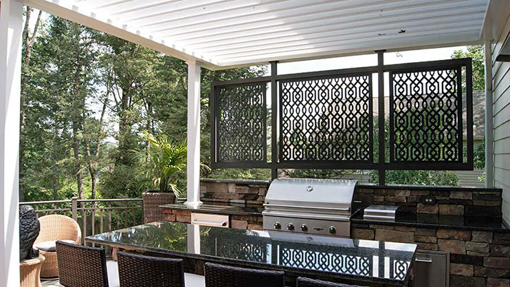 Black Trex Lattice panels used as decorative screen behind outdoor grill